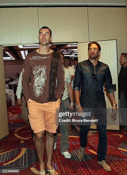 Zdeno Chara of the Boston Bruins and Henrik Lundqvist of the New York Rangers arrive for the NHLPA press conference at Marriott Marquis Times Square...