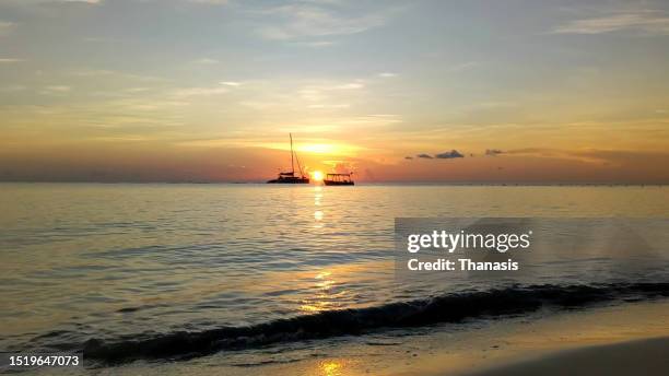 sunset, seven mile beach, negril, jamaica - jamaica beach stock pictures, royalty-free photos & images