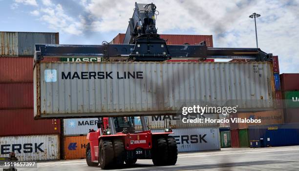 Container handler lifts a Maersk container at the YILPORT Liscon Alcantara Container Terminal a day after dockers started a strike in the ports of...