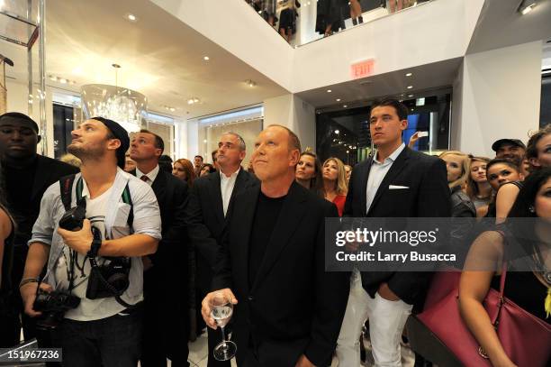 Designer Michael Kors watches a presentation at Kors Collaborations: Claiborne Swanson Frank on September 13, 2012 in New York City.