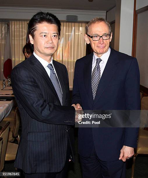 Japan Foreign Minister Koichiro Gemba is greeted by Australian Foreign Minister Bob Carr during the fourth Australia-Japan 2+2 Ministerial Meeting on...