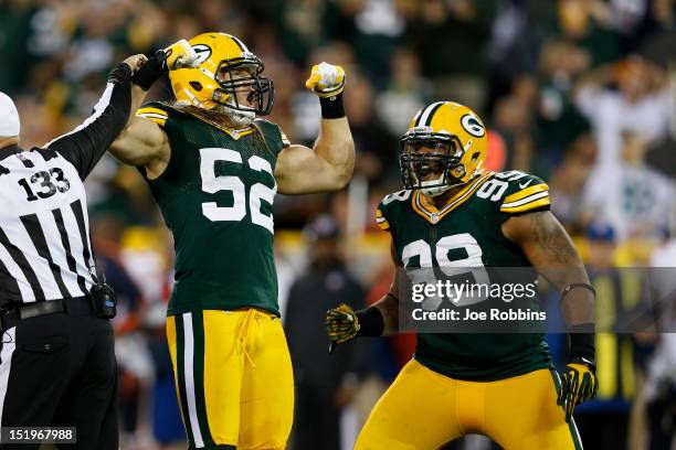 Clay Matthews and Jerel Worthy of the Green Bay Packers celebrate after a sack during first half play against the Chicago Bears at Lambeau Field on...