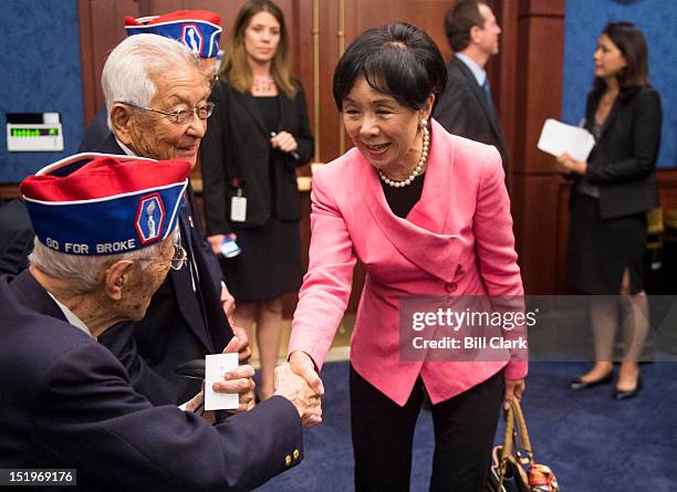Rep. Doris Matsui, D-Calif., shakes hands with World War II veterans of the 442nd Regimental Combat Team and the 100th Infantry Battalion as she...