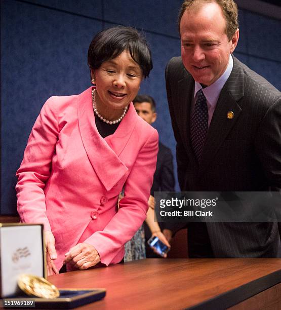 Rep. Doris Matsui, D-Calif., and Rep. Adam Schiff, D-Calif., take a look at the Congressional Gold Medal Awarded to Japanese American World War II...