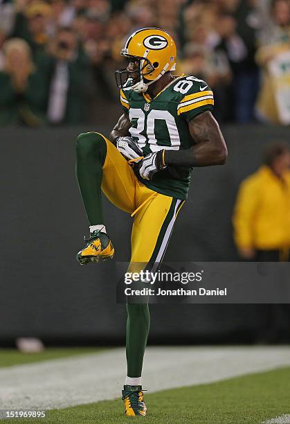 Donald Driver of the Green Bay Packers celebrates a touchdown catch against the Chicago Bears at Lambeau Field on September 13, 2012 in Green Bay,...