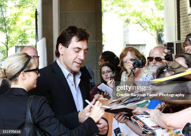 Actor/ Producer Javier Bardem signs autographs for fans at the "Sons Of The Clouds: The Last Colony" premiere during the 2012 Toronto International...