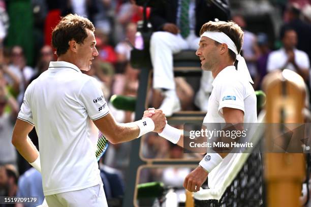 Liam Broady of Great Britain shakes hands with Casper Ruud of Norway following the Men's Singles second round match during day four of The...