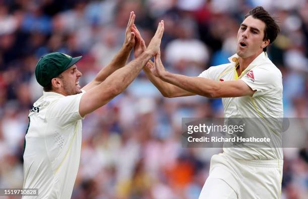 Pat Cummins of Australia celebrates with Mitchell Marsh after taking the wicket of Ben Duckett of England during Day One of the LV= Insurance Ashes...
