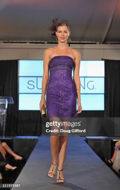 Model walks the runway at the 2012 Sue Wong "Autumn Sonata" collection Fashion Show during the sixth annual Designer Runway event on September 13,...