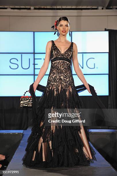 Model walks the runway at the 2012 Sue Wong "Autumn Sonata" collection Fashion Show during the sixth annual Designer Runway event on September 13,...