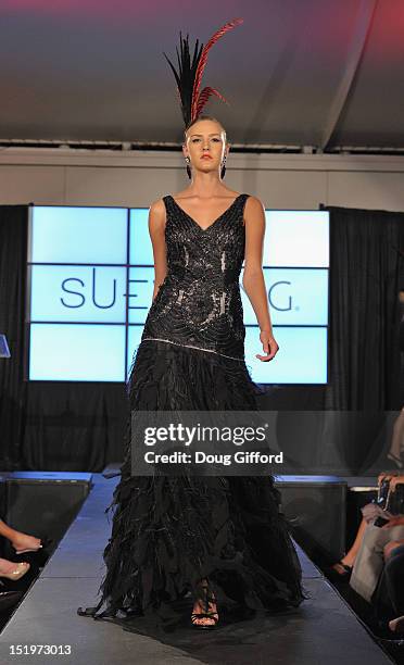 Model walks the runway at the 2012 Sue Wong "Autumn Sonata" collection Fashion Show during the sixth annual Designer Runway event on September 13,...