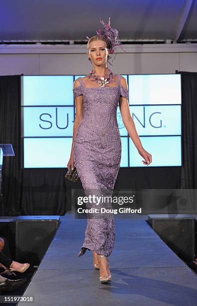 Model walks the runway at the 2012 Sue Wong "Autumn Sonata" collection Fashion Show during the sixth annual Designer Runway event on September 13,...