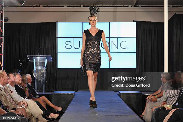 Model walks the runway at the 2012 Sue Wong "Autumn Sonata" collection Fashion Show during the sixth annual Designer Runway event on September 13,...