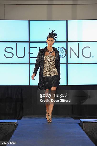 Model walks the runway at the 2012 Sue Wong "Autumn Sonata" collection Fashion Show during the sixth annual Designer Runway event on September 13,...