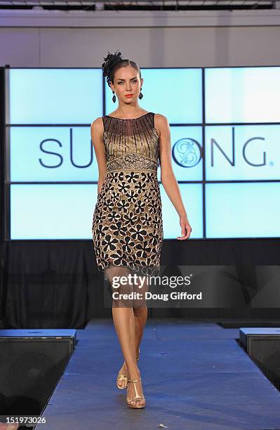 Model walks the runway at the 2012 Sue Wong "Autumn Sonata" collection Fashion Show during the sixth annual Designer Runway event on September 13,...