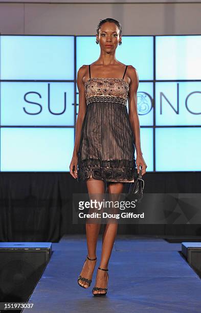Model walks the runway at the 2012 Sue Wong "Autumn Sonata" collection Fashion Show during the sixth annual Designer Runway event on September 13,...