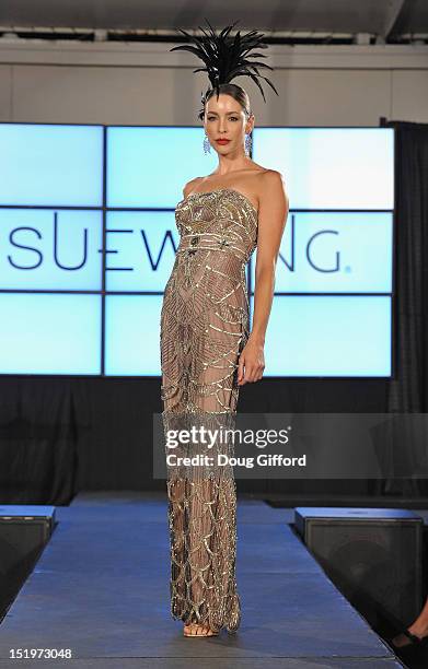 Model walks the runway at the 2012 Sue Wong "Autumn Sonata" collection Fashion Show during the sixth annual Designer Runway event on September 13,...