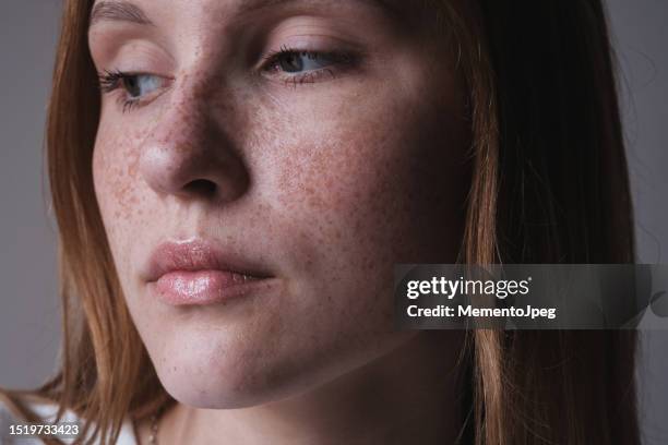 close up of redhead young woman with freckles - freckle stock pictures, royalty-free photos & images