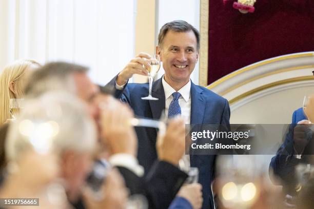 Jeremy Hunt, UK chancellor of the exchequer, raises his glass at the annual Financial and Professional Services Dinner at Mansion House in London,...