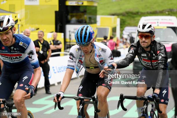 Fabio Jakobsen of The Netherlands crosses the finish line congratulated by his teammate Dries Devenyns of Belgium and Team Soudal - Quick Step during...