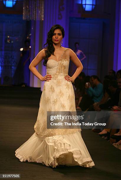 Ankita Shorey showcases a creation by Indian designer Jyotsna Tiwari during Aamby Valley India Bridal Fashion Week 2012 in Mumbai.