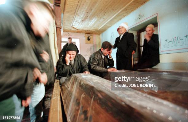 Kosovar families mourn their dead in Racak mosque after the coffins of ethnic Albanians killed in a January 15 massacre were brought to the southern...