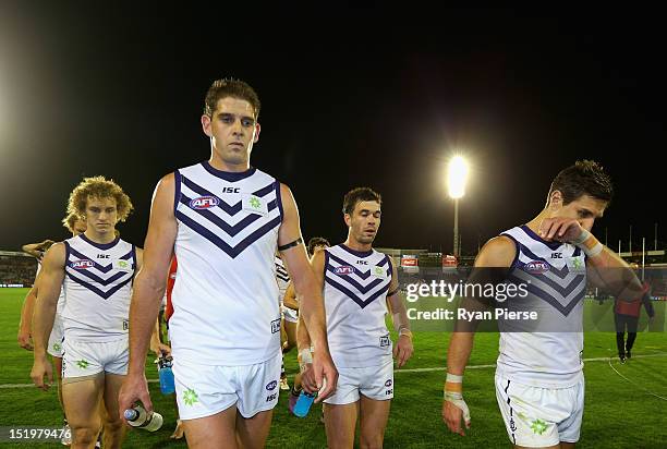 Aaron Sandilands of the Dockers and Matthew Pavlich of the Dockers look dejected as they lead their team from the ground after the AFL Second Semi...