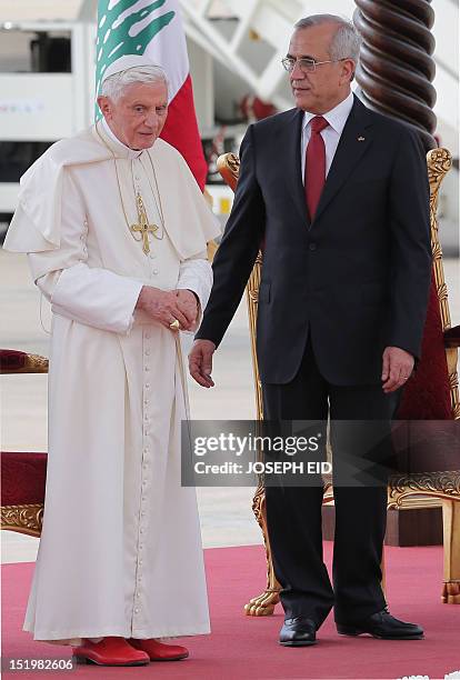 Lebanese President Michel Sleiman welcomes Pope Benedict XVI at Beirut international airport on September 14, 2012. The pope arrived in Lebanon with...