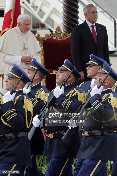 Lebanese President Michel Sleiman and Pope Benedict XVI review an honour guard during an official welcoming ceremony for the latter at Beirut's...