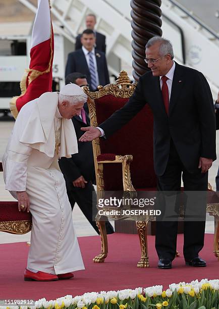 Lebanese President Michel Sleiman welcomes Pope Benedict XVI at Beirut's international airport on September 14, 2012. The pope arrived in Lebanon...