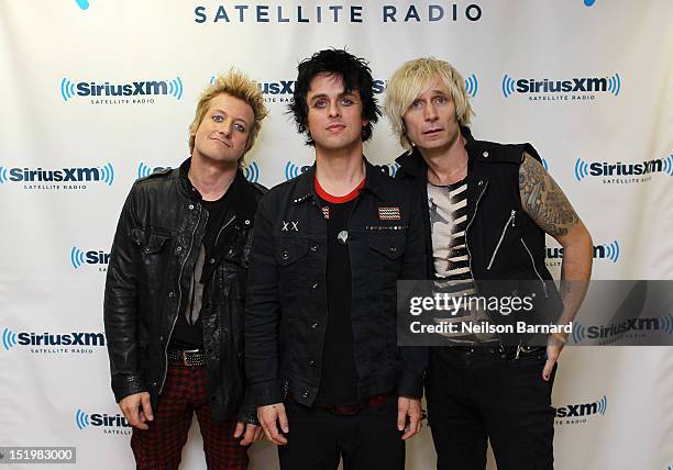 Tre Cool, Billie Joe Armstrong and Mike Dirnt of Green Day visit the SiriusXM Studios on September 14, 2012 in New York City.