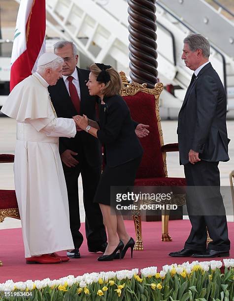 Lebanese President Michel Sleiman stands next to Pope Benedict XVI as former first lady Joyce Gemayel greets the pontiff with her husband, former...