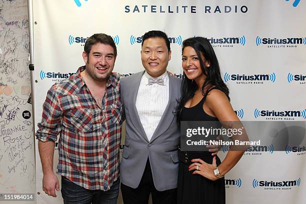 South Korean rapper Park Jae-Sang aka Psy poses with The Morning Mash Up's Ryan Sampson and Nicole Biggins how to "Gangnam Style" at the SiriusXM...