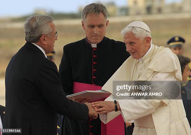 Lebanese President Michel Sleiman welcomes Pope Benedict XVI at Beirut international airport on September 14, 2012. The pope arrived in Lebanon at...