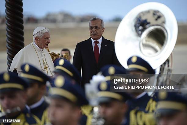 Lebanese President Michel Sleiman welcomes Pope Benedict XVI with an honour guard at Beirut international airport on September 14, 2012. The pope...