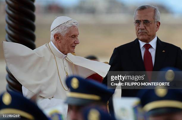 Lebanese President Michel Sleiman welcomes Pope Benedict XVI with an honour guard at Beirut international airport on September 14, 2012. The pope...