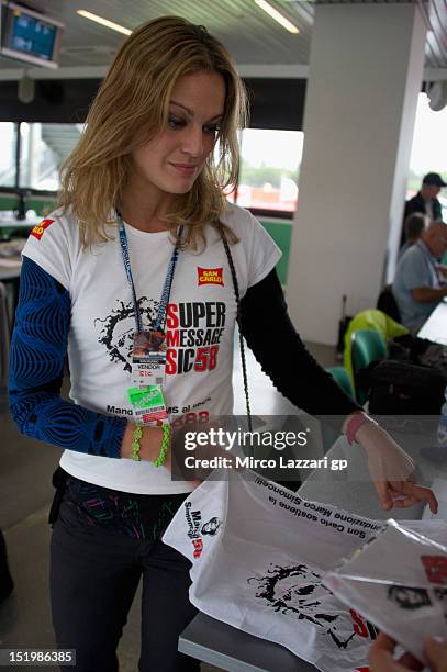 Girl promotes the Marco Fimoncelli Fondation in paddock during the free practice of the MotoGP of San Marino at Misano World Circuit on September 14,...