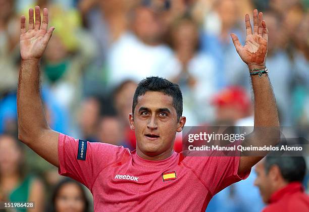 Nicolas Almagro of Spain celebrates his win over John Isner of the United States during day one of the semi final Davis Cup between Spain and the...