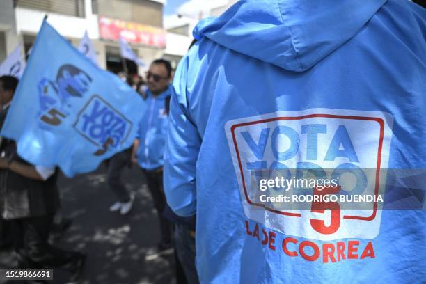 Supporters of Ecuador's presidential candidate for the Revolucion Ciudadana party, Luisa Gonzalez, participate in a caravan in northern Quito on July...