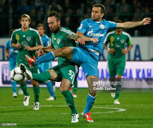 Martin Jiranek of FC Terek Grozny competes for the ball with Alexandr Kerzhakov of FC Zenit St. Petersburg during the Russian Football League...