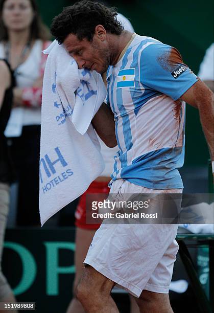 Juan Monaco of Argentina leaves the court after being defeated by Tomas Bedych during the second Davis Cup semi-final match between Argentina and...