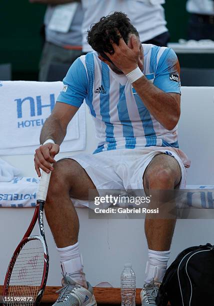 Juan Monaco of Argentina laments after beinmg defeated the second Davis Cup semi-final match between Argentina and Czech Republic at Mary Teran de...