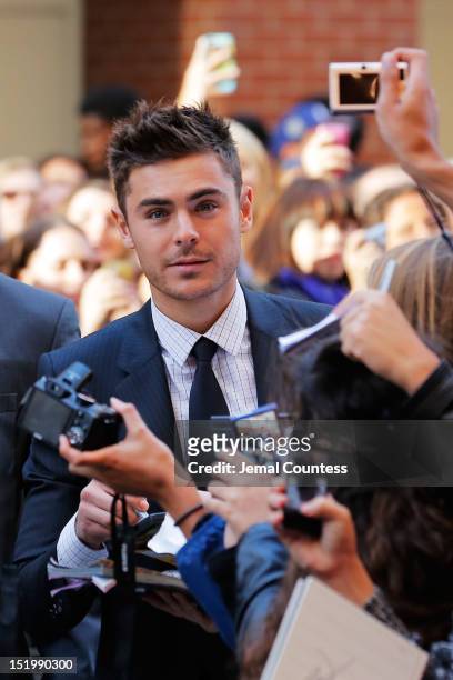Actor Zac Efron signs autographs as he attends the "The Paperboy" premiere during the 2012 Toronto International Film Festival on September 14, 2012...