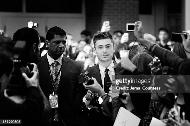 Actor Zac Efron signs autographs as he attends the "The Paperboy" premiere during the 2012 Toronto International Film Festival on September 14, 2012...