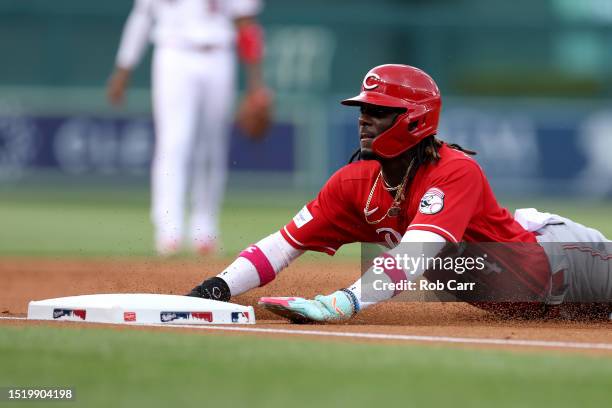 Elly De La Cruz of the Cincinnati Reds slides safely into third base in the second inning against the Washington Nationals at Nationals Park on July...