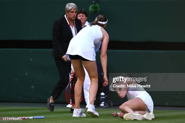 Alize Cornet of France goes down with a injury against Elena Rybakina of Kazakhstan in the Women's Singles second round match during day four of The...