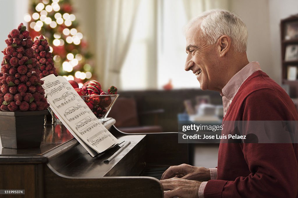 Senior man playing piano