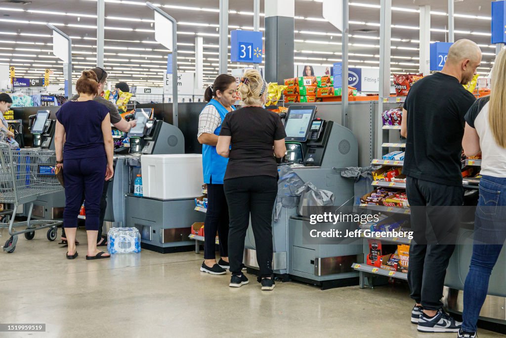 Miami, Florida, Doral, Walmart store, self service checkout, associate helping
