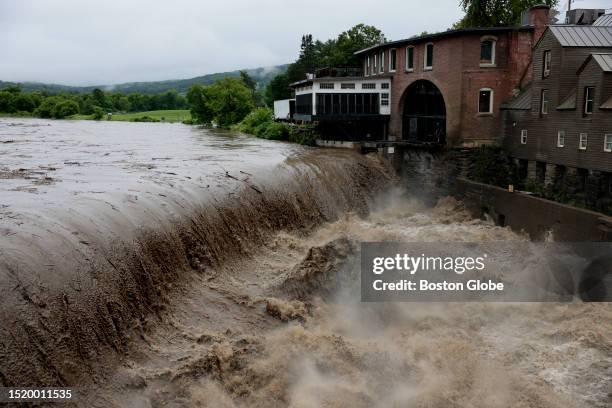 Quechee, VT Heavy rain sends mud and debris down the Ottauquechee River.