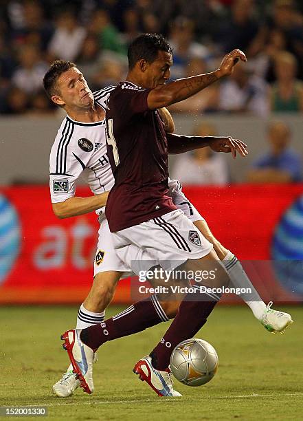 Tyrone Marshall of the Colorado Rapids defends Robbie Keane of the Los Angeles Galaxy in the second half during the MLS match at The Home Depot...